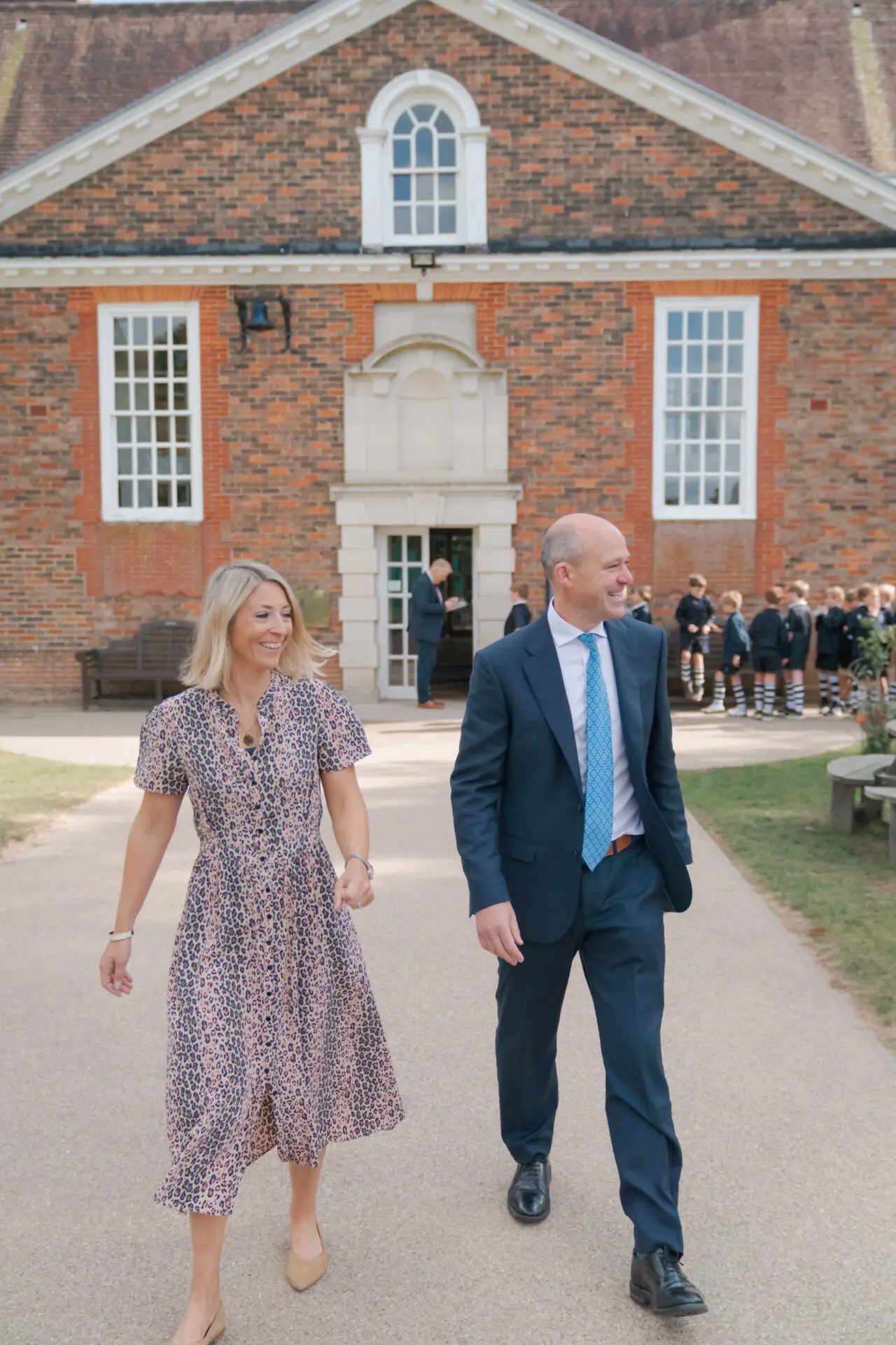The head and his wife walking around the school grounds Image of the head and his wife walking around the school grounds