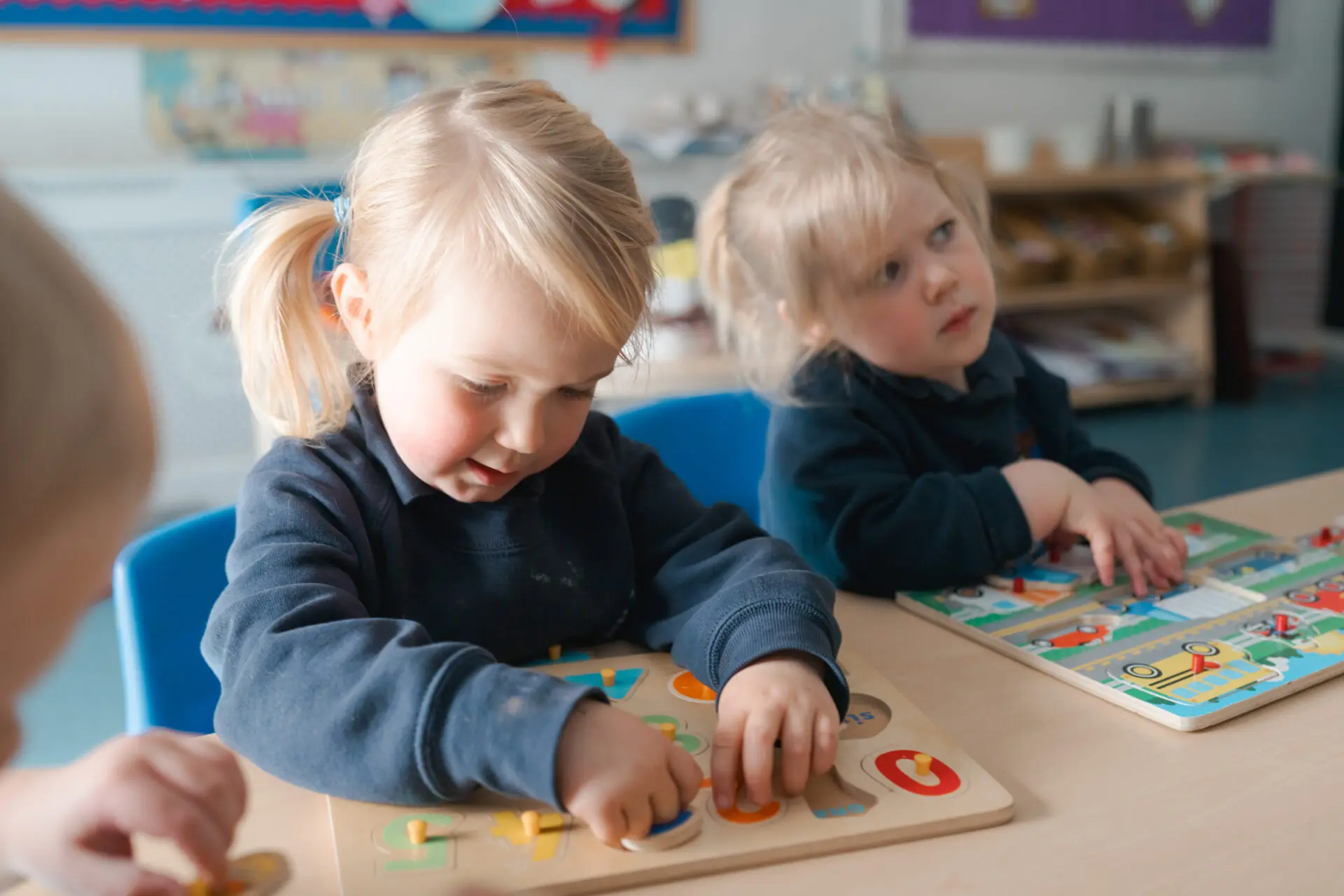 Little Amesbury pupils playing with wooden toys Image of Little Amesbury pupils playing with wooden toys