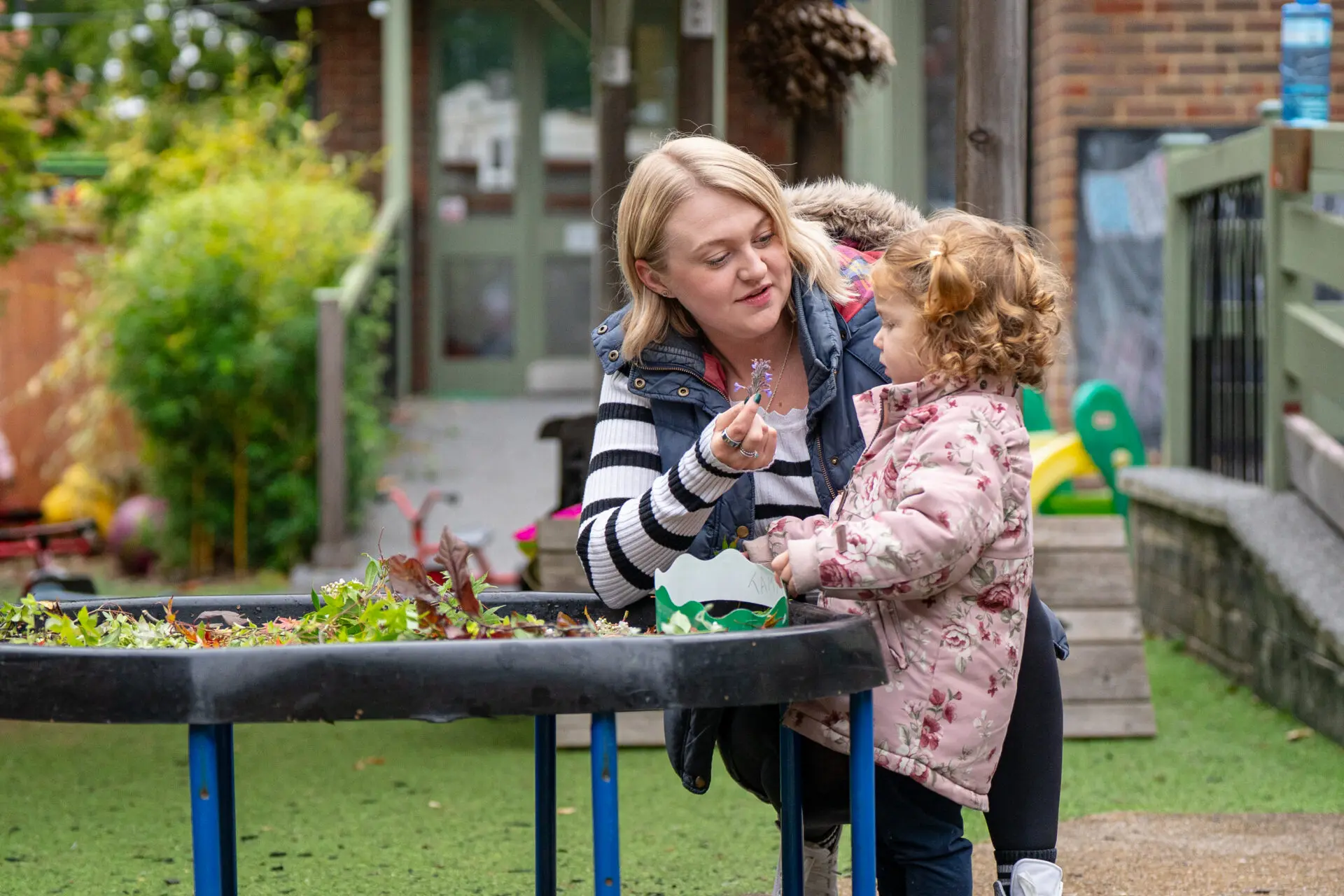 Bex Norton showing young student different types of folliage