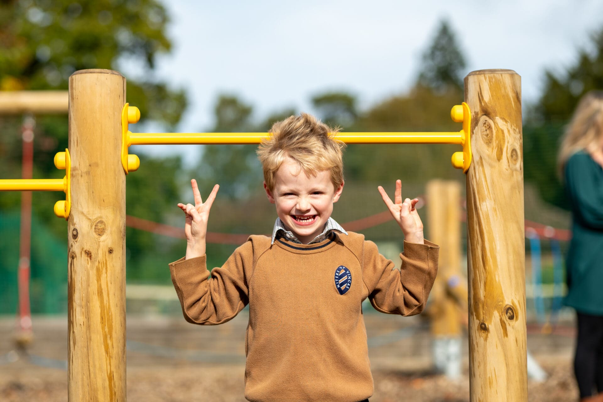 an image of a boy signing peace